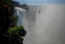 Slack line crossing at Victoria Falls in Zimbabwe